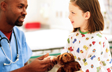 Doctor holding a little girls hand