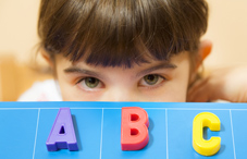 Young girl and the letters ABC