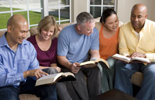 A group of adults reading Bibles