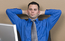 Young, confident professional with hands behind his head Young, confident professional with hands behind his head