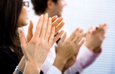 Three people clapping