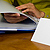 Woman looking through binder Woman looking through binder