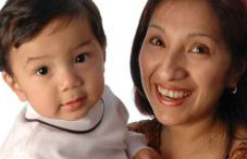 Hispanic mother holding her son Hispanic mother holding her son