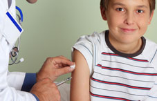 Kid recieving a shot from a doctor