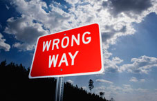 "Wrong Way" street sign