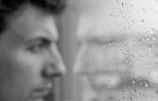 Man's face and reflection in black and white Man's face and reflection in black and white