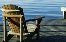 Chair on lakeside deck 