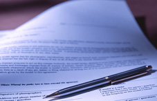 an ink pen laying on a document an ink pen laying on a document