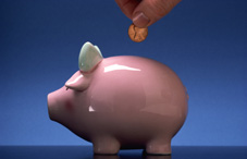 Putting a penny in a piggy bank Putting a penny in a piggy bank
