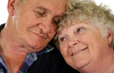 Elderly couple cuddling 