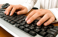 Hands typing on a keyboard Hands typing on a keyboard