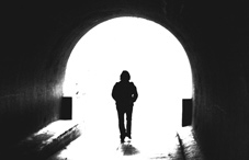 Person walking through a tunnel Person walking through a tunnel