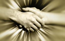 Shaking hands with gold background Shaking hands with gold background