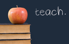 An apple on a stack of books