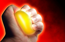 Hand gripping a stress ball Hand gripping a stress ball