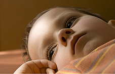 Thoughtful child lying on his back Thoughtful child lying on his back