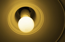 Closeup of bare lightbulb lamp Closeup of bare lightbulb lamp