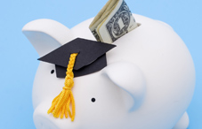 Piggy bank with graduation cap and money Piggy bank with graduation cap and money