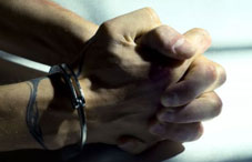 Man wearing handcuffs Man wearing handcuffs