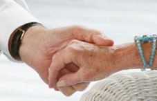Man holding elderly's hand Man holding elderly's hand