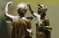 Justice statue and reflection in mirror Justice statue and reflection in mirror