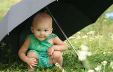 Child under umbrella Child under umbrella