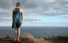 Lone woman overlooking the ocean