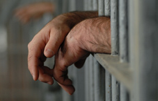 Inmates hands through prison bars Inmates hands through prison bars
