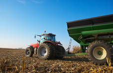 Farm equipment working the fields Farm equipment working the fields