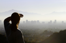 Silhouetted person looking into the distance