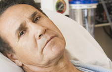 Hispanic man in hospital bed Hispanic man in hospital bed