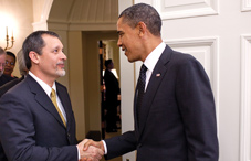 President Barack Obama greets Dr. Julio J. Ramirez (Official White House photo by Pete Souza)