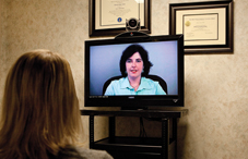 Dr. Patricia Arena — on the screen — has provided telehealth services for years (credit: Gregg Perry) Dr. Patricia Arena — on the screen — has provided telehealth services for years (credit: Gregg Perry)