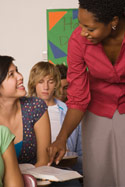 Teacher talking with high school students