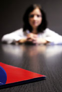 Lady sitting at table Lady sitting at table