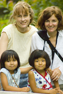 Two women and their daughters Two women and their daughters