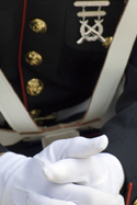 Closeup on soldier with hands folded in lap