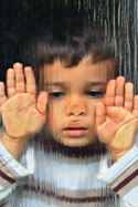 child behind glass
