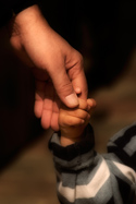Holding hands with a child
