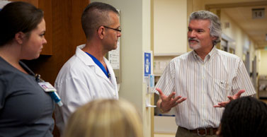 Dr. Salas talks with emergency room nurses.