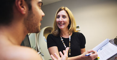 Dr. Tate discusses behavior modifications with a study participant.