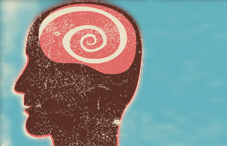 Drawing of a head with a swirl at the brain