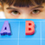Young girl and the letters ABC