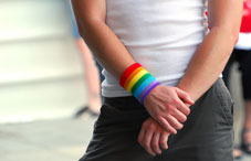 Someone wearing a rainbow wristband