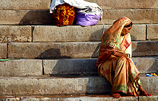 Indian women sitting on brick steps