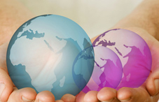 Pair of hands holding three planets