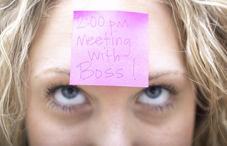 Woman with post-it note on forehead