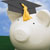 Graduation cap on a piggy bank    