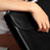 Woman opening a briefcase