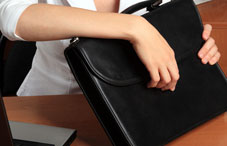 Woman opening a briefcase